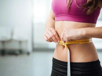 Tape measure around a woman's waist