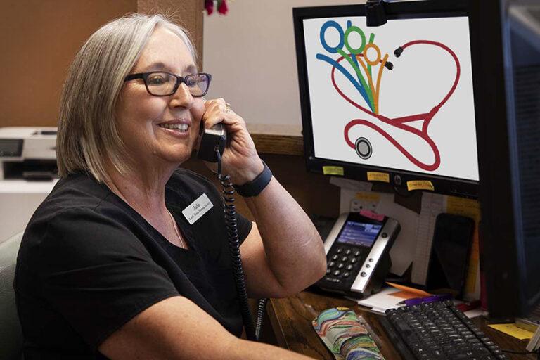 Julie on the phone at North Texas Family Health