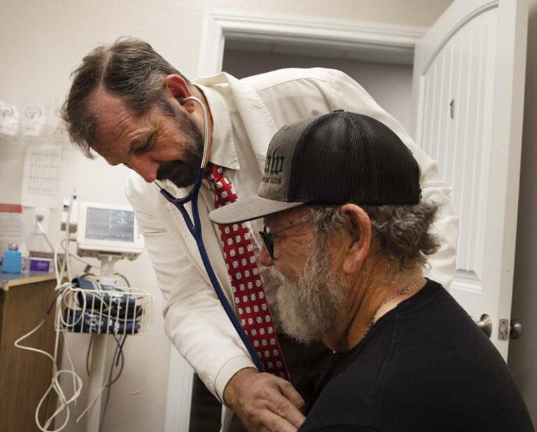 Richard Templeman checking patient's heart