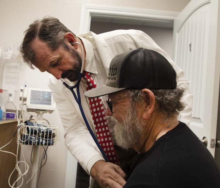 Richard Templeman checking patient's heart